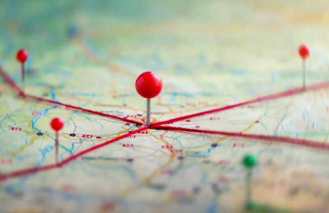 Find your way. Location marking with a pin on a map with routes.