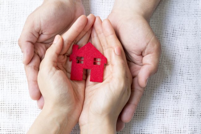 Hands Holding Home